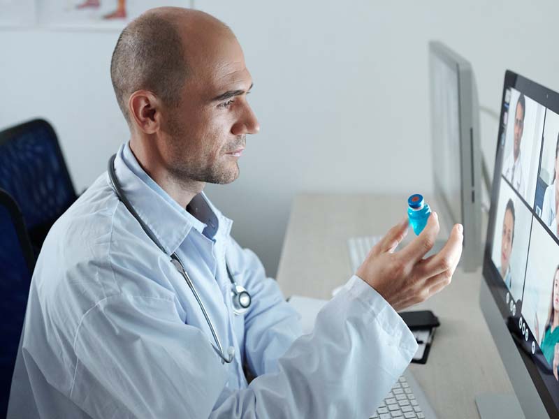 doctor in a telehealth call discussing prescriptions with patient